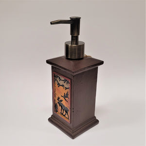 Moose soap dispenser seen angled with the solid colored side in full view and the amber moose scene in diagonal to the left.