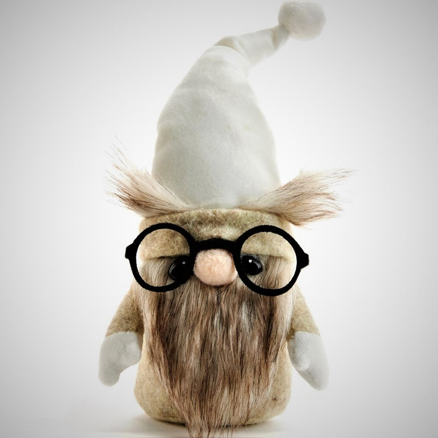 Owl gnome standing upright on a white background. A pointy white hat tipped with a white pompom and trimmed with beige band and furry eyebrows rest behind and above circular black glasses. This gnome has a brown variegated colored beard, beige body, and white hands (round bottom, no feet.)