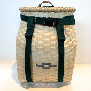 Front of adult pack basket with dark brown strap trim