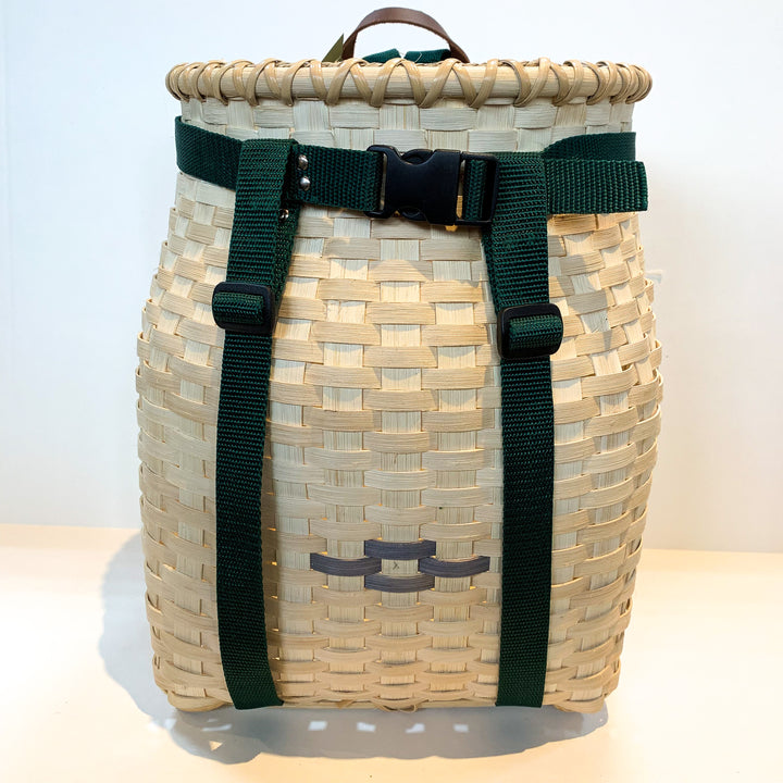 Front of adult pack basket with dark brown strap trim