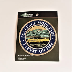 Single patch with a navy circle border and white embroidered text reading SCARFACE MOUNTAIN ELEVATION 3088, with mountain scene embroidered in circle in a circle.