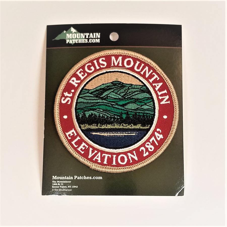Single patch with a red circle border and white embroidered text reading St. REGIS MOUNTAIN ELEVATION 2874, with mountain scene embroidered in circle in a circle.
