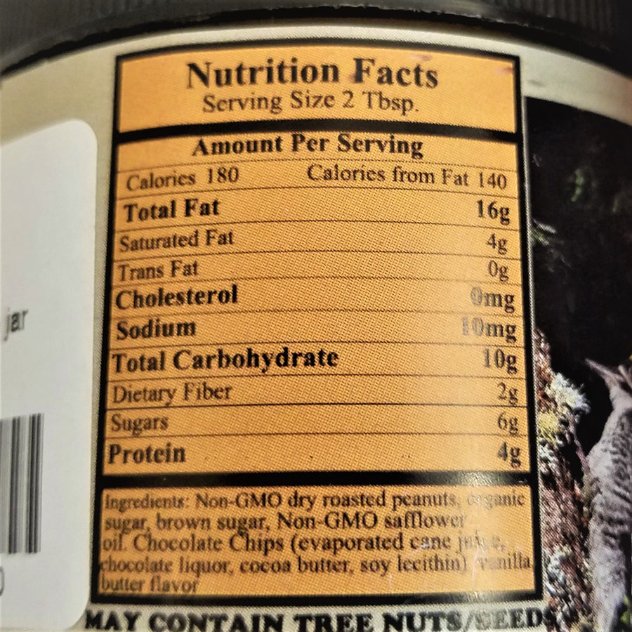 The back of a jar of Adirondack Gourmet Peanut Butter featuring the Nutrition Facts and ingredients on a gold label.