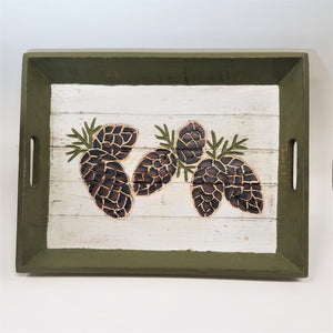 Green trim-edged tray with white base and 6 pine cones depicted on surface.