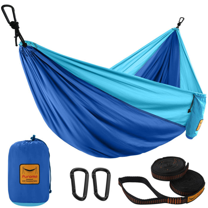 Aqua blue and Columbia blue hammock spread open in center of frame. Below the hammock folded up in its blue sack. To the right of that two black braces  and far right orange and black straps coiled.