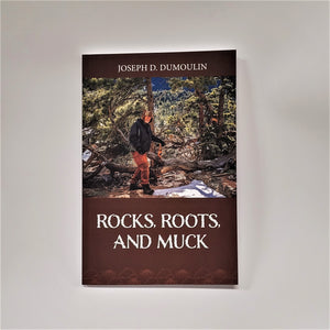Cover of Rocks, Roots, and Muck book. White type on brown colored bottom third. Very top white text Joseph D. Dumoulin on brown. Just below the author's name is a full-color photograph of a man in winter gear amidst a moutain-forested background.