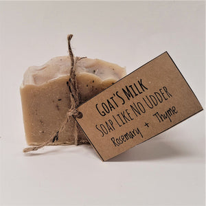 Single bar of Goat's Milk Rosemary & Thyme soap standing upright with beige twine circling the center holding the beige label.
