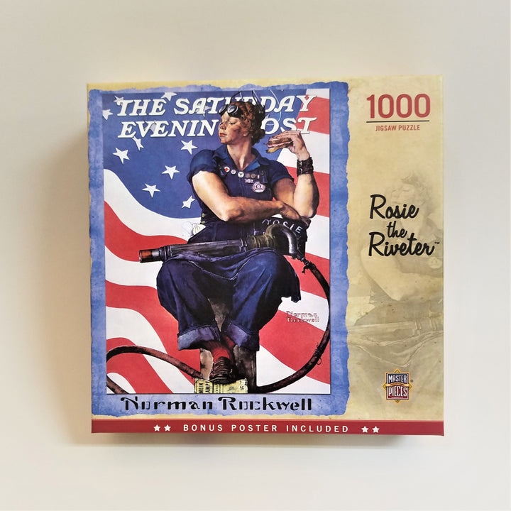 Box cover of 1000 piece jigsaw puzzle featuring The Saturday Evening Post Norman Rockwell, Rosie the Riveter. Red, white and blue flag background with woman in blue with medals sitting in the center.