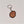 Single leather key chain with SARANAC LAKE NY in brown lettering within the park outline, attached to a silver chain and keyring.