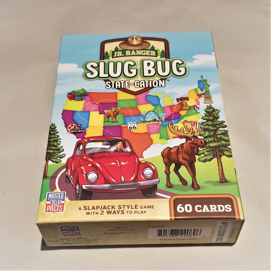 Cover of Jr. Ranger Slug Bug State-Cation Card Game lying flat depicting a colorful map of the USA with iconic images placed on some of the state; a red Volks bug, a moose and two pine trees.