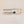 Tube of Northwoods paw balm on its side on a white background. The Northwoods logo is seen below a list of ingredients.