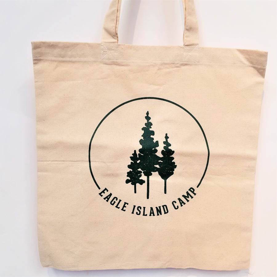 Upright cream colored tote with no padding. The green, Eagle Island logo appears centered on the front.