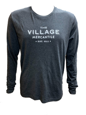 Long-sleeve charcoal t-shirt with lettering in the center in white: THE VILLAGE MERCANTILE Est. 2011