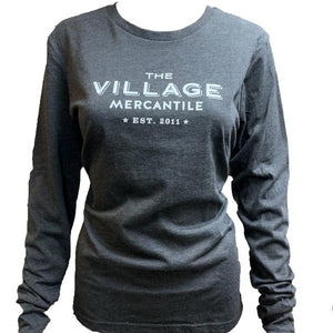 Long-sleeve charcoal t-shirt with lettering in the center in white: THE VILLAGE MERCANTILE Est. 2011