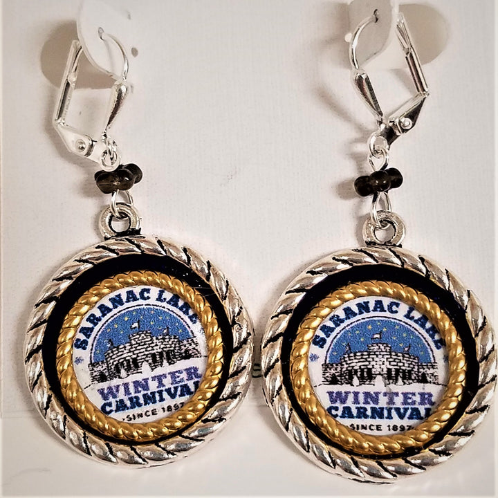 Dangling Winter Carnival circular earrings. Gold braided bands and black band surround Saranac Lake Winter Carnival blue, white & black logo. 