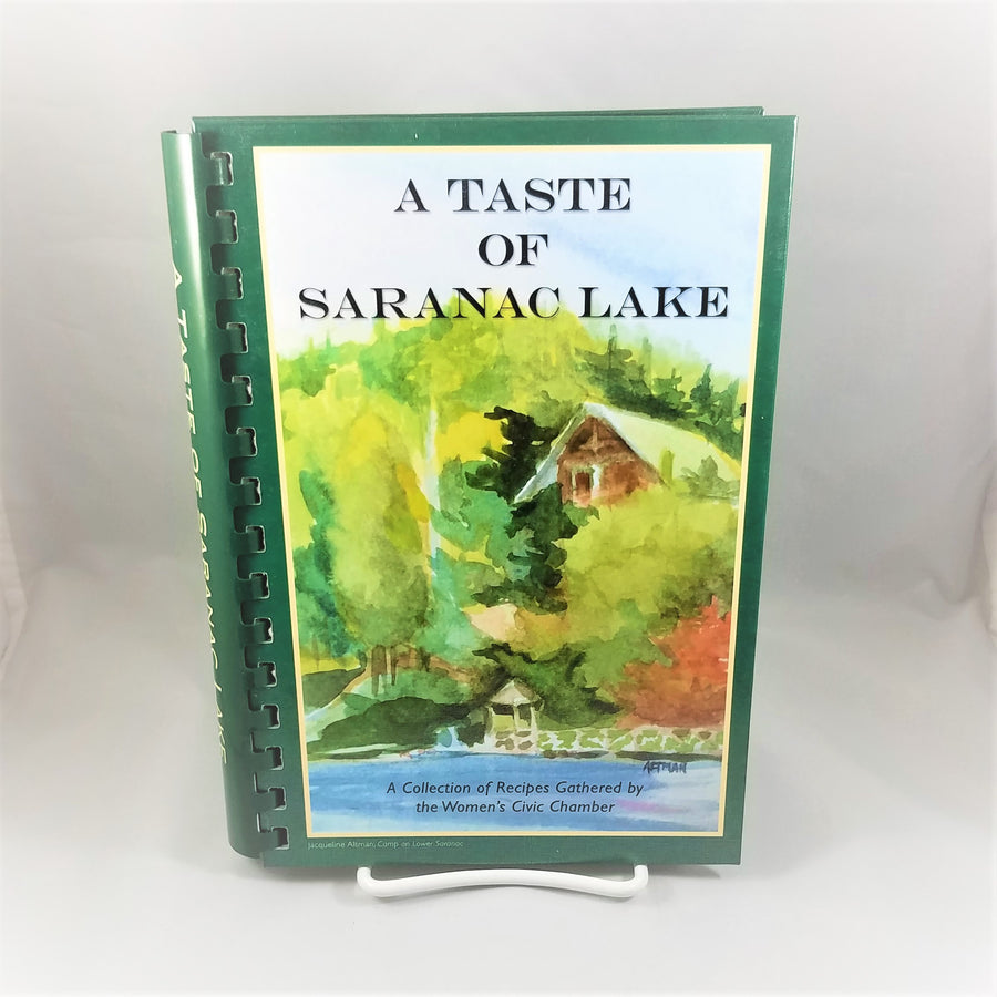Book cover featuring a typical Adirondack camp on the lake