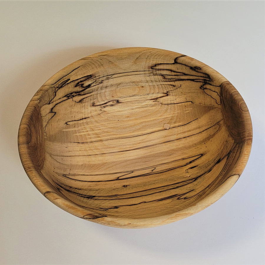 Inside of the white birch bowl with just the outer rim showing.