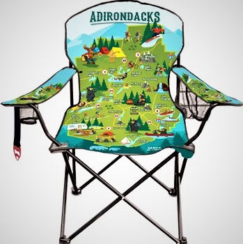 Folding chair opened up to display the colorful Adirondack Park illustrated map which takes up the whole back and seat. More colors and scenery on the arms as well.