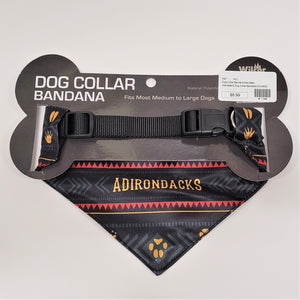 The back side of the dog collar bandana showing the black strap on the back of the black cardboard packaging. Below that can be seen the red Aztec-design with the gold lettering ADIRONDACKS in the middle and the bottom triangle has a gold paw print in the center on a gray/black design.