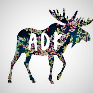 Decal of moose in navy floral pattern with white lettering ADK on body of moose.
