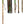 View of walking stick assembled, in 3 pieces in black plastic carry pack, in 3 pieces top, bottom, middle to illustrate how to assemble