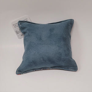 Solid light blue back of red fox pillow.