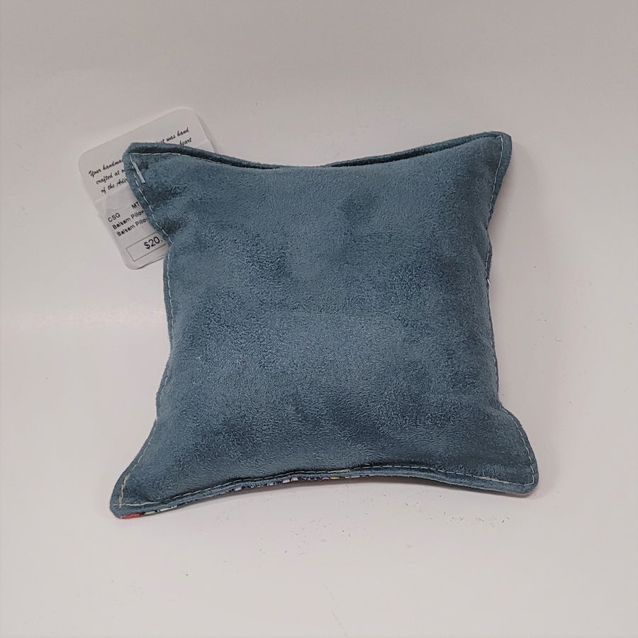 Solid light blue back of red fox pillow.