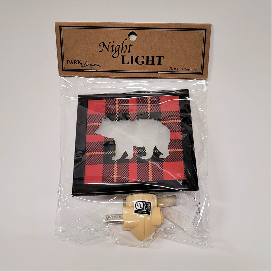 Bear night light in its clear plastic packaging with  a brown label on top that says Park Designs; Night Light UL & CUL Approved.