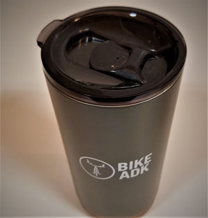 View of charcoal gray tumbler from the top down. Black plastic cap clear to see over the tumbler and its white lettering.