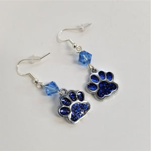 Blue dog paw earrings with blue glass bead and silver trim.