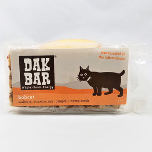 The bobcat Dak bar stands upright with some of the actual bar peeking through the packaging to the left and at the bottom.