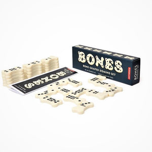 BONES Box and game pieces opened up to sow the bone-shaped dominoes and the rules of the game