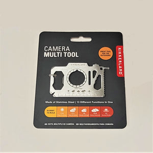 Camera Multi Tool set flat on its charcoal-colored package card. A color section on the bottom of the card features the SUNNY 16 RULE with illustrative photos of clouds and sun.