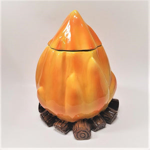 Campfire cookie jar--brown ceramic log bottom, big orange-yellow ceramic base and top.