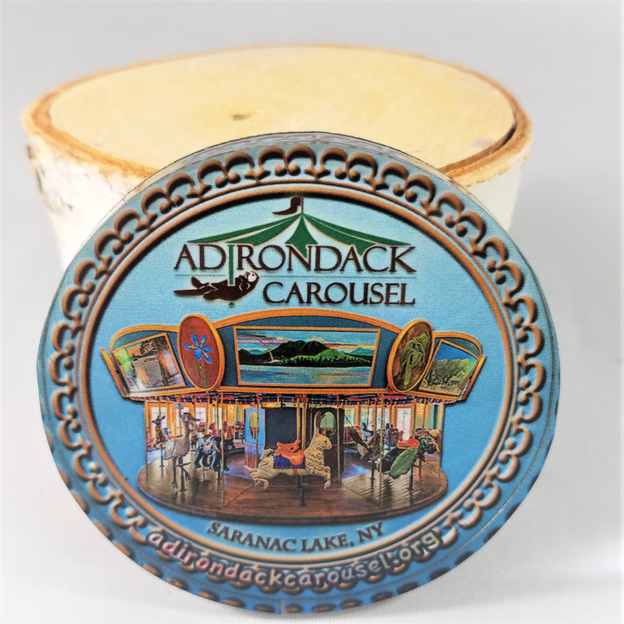 close up of Adirondack Carousel magnet with logo and carousel depicted