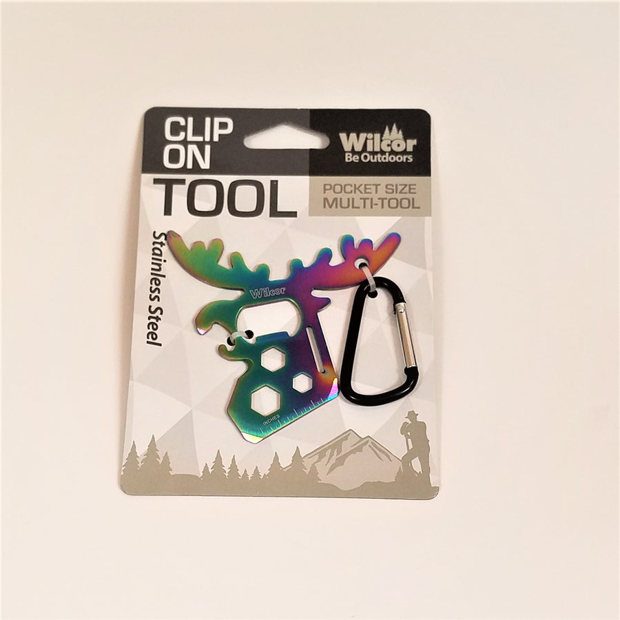 Clip-on Moose Tool in packaging. Stainless steel moose appears with shades of blue on the left side and a purply pink right edge next to the black and silver carabiner clip.