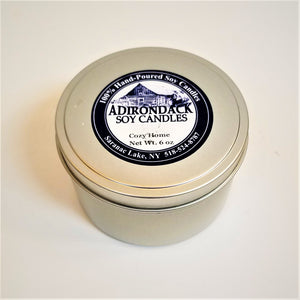 One closed 6-ounce tin of Cozy Home soy candle