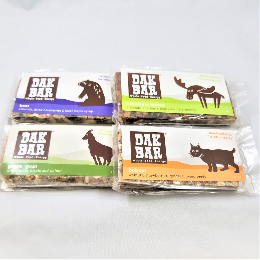 4 Dak bars displayed flat. Top left Bear bar, to the right the Chocolate Moose bar, below that the Bobcat bar and to the left the Green Goat bar.