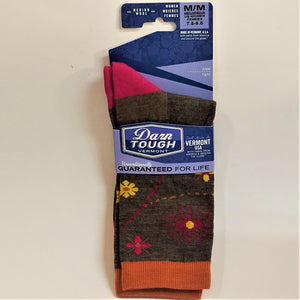 Full view of Blue labeled Darn Tough Women's socks: solid brown with red, yellow, pink flowers and dotted lines, pink heel and orange cuff