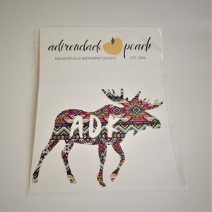 Decal of moose in pink aztec pattern with white lettering ADK on body of moose.