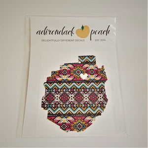 Single aztec-patterned decal in pinks, aqua, black, gold, shape of Adirondack Park with white heart in top third slightly off center, on a white background.