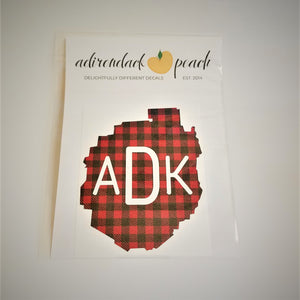 Decal of the Adirondack Park boundaries in buffalo plaid with white ADK lettering centered in the design.