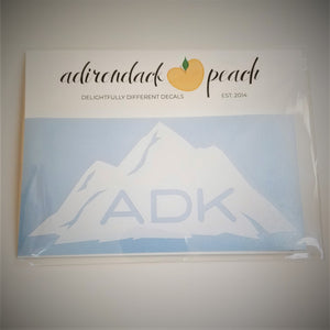 Adirondack mountain decal in white on a pale blue background with ADK lettering printed at the base of the mountain