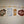 Fanned out display of Adirondack Park boundaries decals in navy floral pattern, white, yellow floral and buffalo plaid pattern with white ADK lettering printed in the middle of the decals