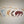 Fanned out display of Adirondack Park boundaries decals in white, wood grain, navy floral and buffalo plaid pattern with two white pine trees seen in full on the buffalo plaid pattern furthest to the right.
