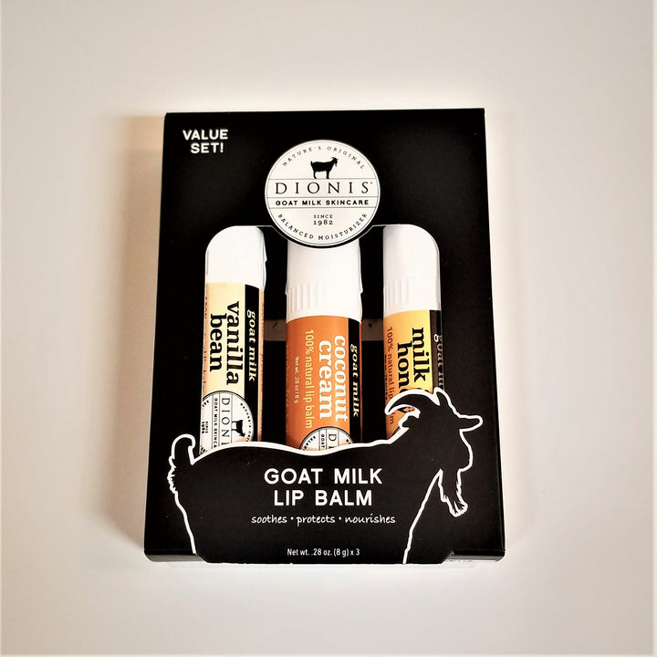 3 varieties of Dionis Goat Milk Lip Balm in the black box packaging. Vanilla bean to the left, coconut cream in the middle and milk & honey to the right.