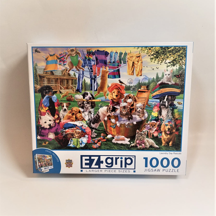 Box cover of 1000 jigsaw puzzle featuring dogs and cats in laundry baskets, hanging on a line with the clothes and holding and wearing various clothes and wash accessories. 