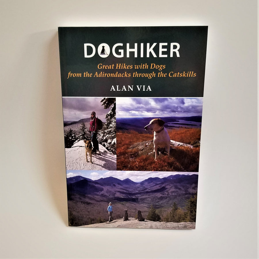 Cover of book showcases 3 color photos: one of a women and dog standing in a snow-covered landsacpe, one with a single dog looking out from what looks like the top of the world on an  autumn-hued mountain with the lake country behind. The third is a mountain backdrop with a woman and two dogs posed with their backs to the camera looking at the incredible view.