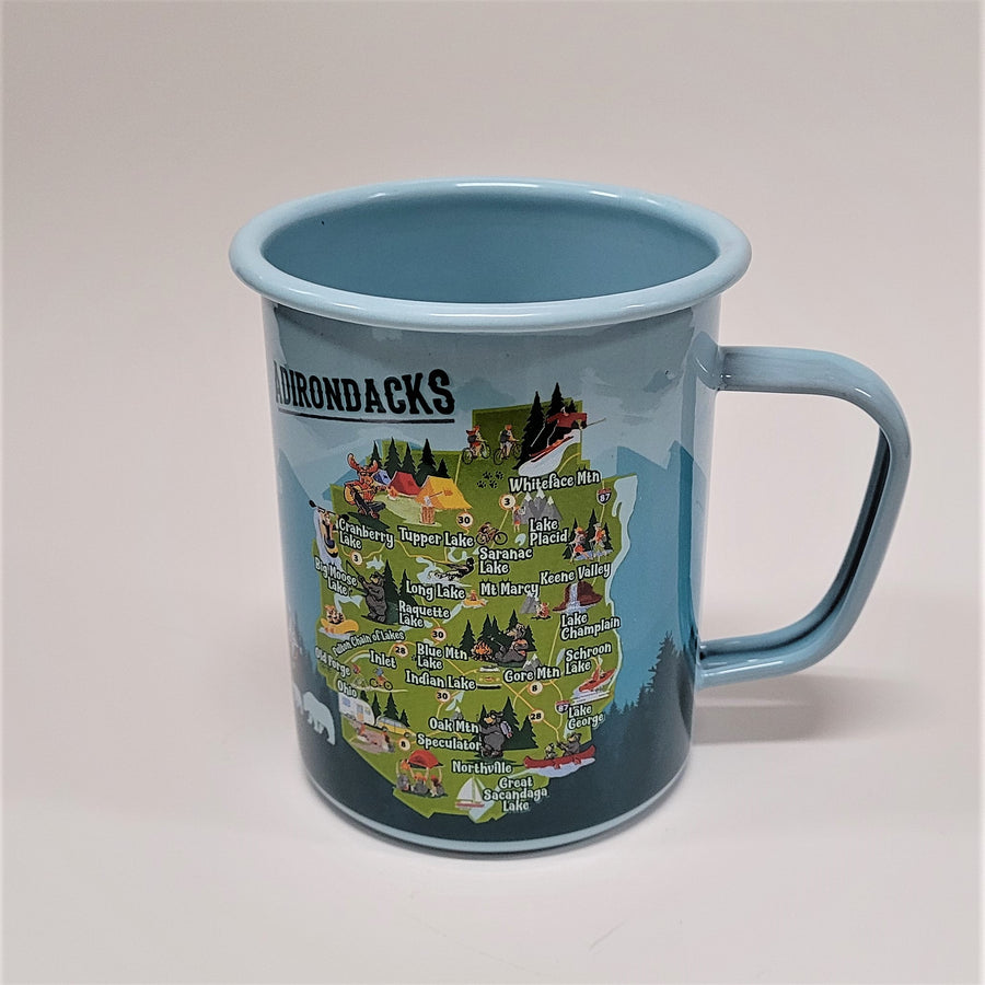 The Adirondack Park mug with the handle to the right and the colorful map in the center of shades of blue background. Most of the word ADIRONDACKS can be seen in the top left part of the mug.