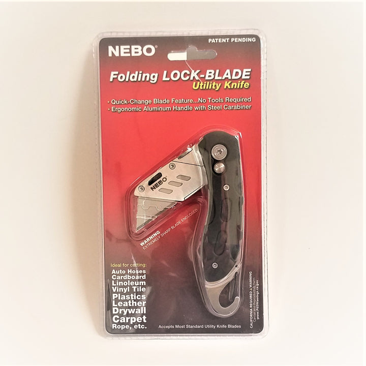 Packaged Folding Lock-Blade Utility Knife. Red backing with clear plastic cover to show off silver blade and black handle.